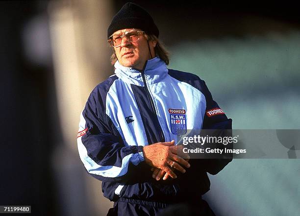 Tommy Raudonikis, coach of the New South Wales Blues looks at his players during a training session prior to the 1997 State of Origin match between...