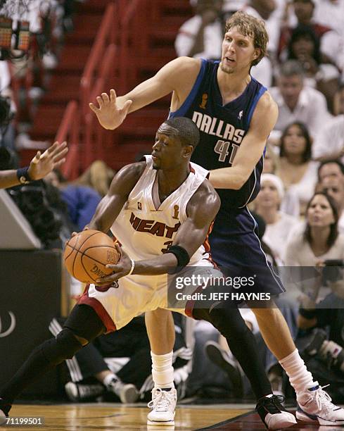 Germany's Dirk Nowitzki of the Dallas Mavericks defends against Dwyane Wade of the Miami Heat during Game 3 of the NBA finals at American Airlines...