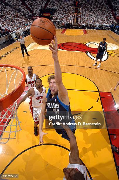 Dirk Nowitzki of the Dallas Mavericks drives to the basket against the Miami Heat during Game Three of the 2006 NBA Finals June 13, 2006 at American...