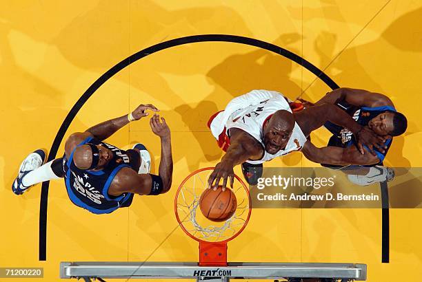 Shaquille O'Neal of the Miami Heat dunks against Adrian Griffin of the Dallas Mavericks during Game Three of the 2006 NBA Finals June 13, 2006 at...