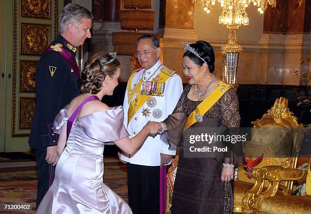 Thailand's King Bhumibol Adulyadej and Queen Sirikit greet Crown Prince Philippe of Belgium and Princess Mathilde of Belgium as they attend the Royal...