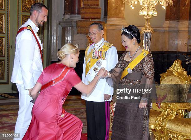 Thailand's King Bhumibol Adulyadej and Queen Sirikit greet Crown Prince Haakon of Norway and Princess Mette-Marit of Norway as they attend the Royal...