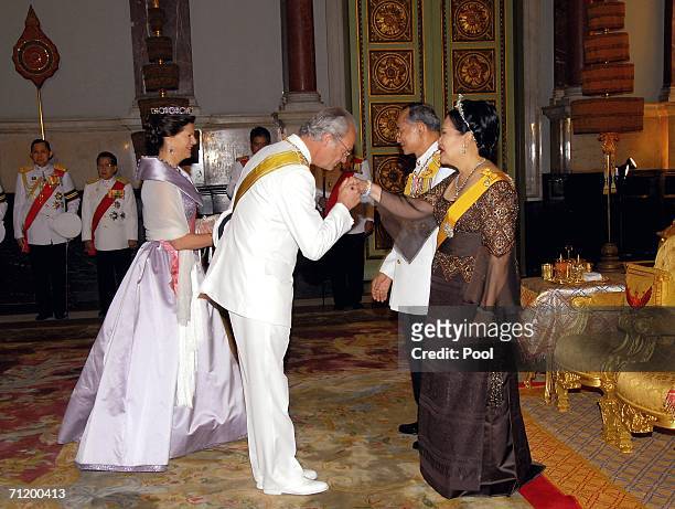 Thailand's King Bhumibol Adulyadej and Queen Sirikit greet Queen Silvia of Sweden and King Carl Gustav of Sweden as they attend the Royal banquet at...