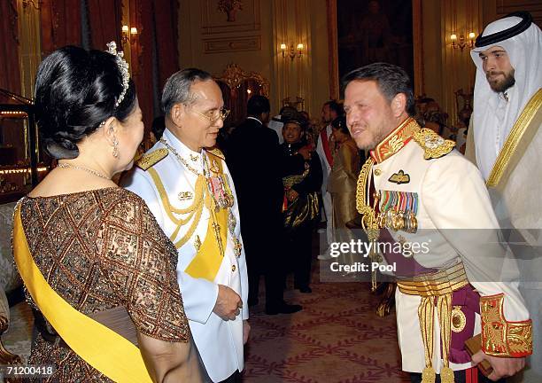 Thailand's King Bhumibol Adulyadej and Queen Sirikit greet King Abdullah II Bin Al-Hussein of Jordan as they attend the Royal banquet at the Golden...