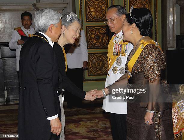 Thailand's King Bhumibol Adulyadej and Queen Sirikit greet Emperor Akihito of Japan and Empress Michiko of Japan as they arrive to attend the Royal...