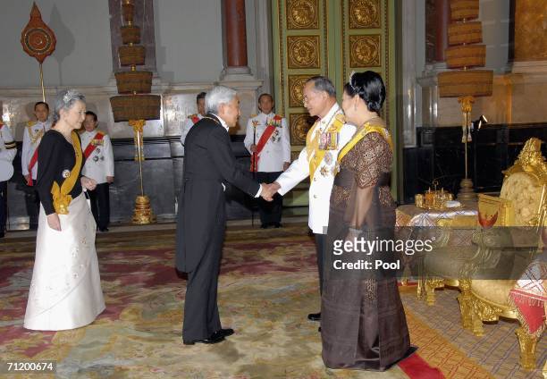 Thailand's King Bhumibol Adulyadej and Queen Sirikit greet Emperor Akihito of Japan and Empress Michiko of Japan as they arrive to attend the Royal...