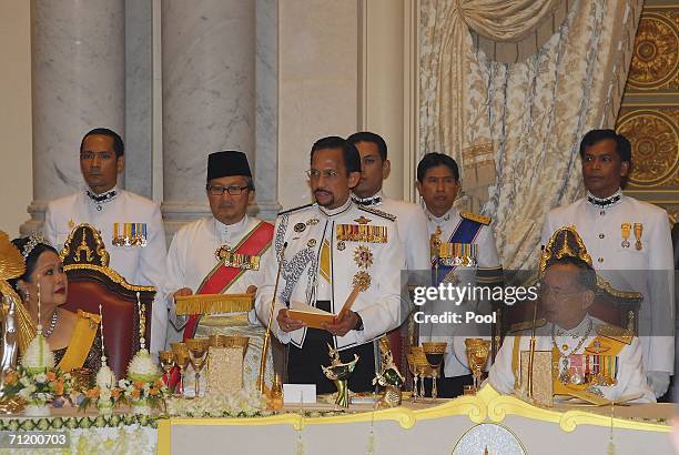 Thailand's King Bhumibol Adulyadej and Sultan of Brunei look on during the Royal banquet at the Golden Palace on June 13, 2006 in Bangkok, Thailand....