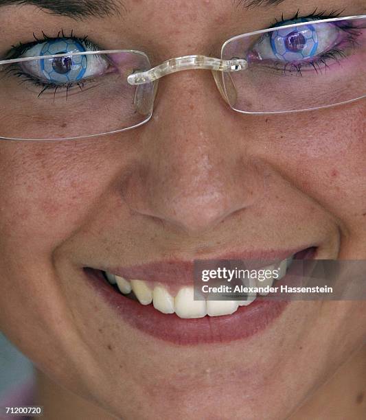 Woman wears contact lenses with a football design during day six of the FIFA 2006 World Cup on June 14, 2006 in Dortmund, Germany.