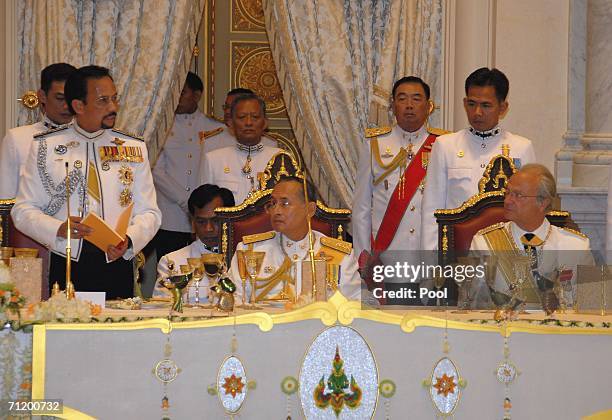 Thailand's King Bhumibol Adulyadej , King Carl Gustav of Sweden and the Sultan of Brunei look on during the Royal banquet at the Golden Palace on...