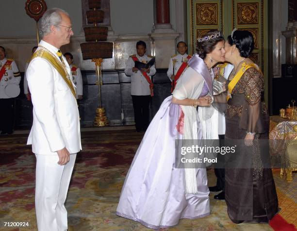 Thailand's King Bhumibol Adulyadej and Queen Sirikit greet Queen Silvia of Sweden and King Carl Gustav of Sweden as they attend the Royal banquet at...