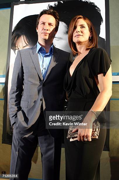 Actors Keanu Reeves and Sandra Bullock pose at the premiere of Warner Bros. Pictures' "The Lake House" at the Cinerama Dome on June 13, 2006 in Los...