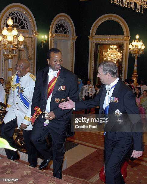 Prince Andrew, Duke of York speaks with King Mswati III of Swaziland as they arrive to attend the Royal banquet at the Golden Palace on June 13, 2006...