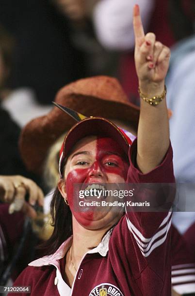 Maroons fan celebrates during game two of the ARL State of Origin series between the Queensland Maroons and the New South Wales Blues at Suncorp...