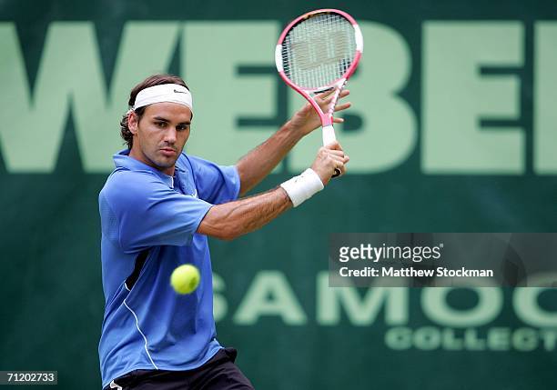 Roger Federer of Switzerland returns a shot to Rohan Bopanna of India during the Gerry Weber Open June 14, 2006 at Gerry Weber Stadium in Halle,...