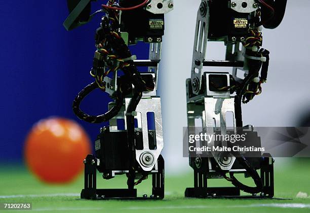 Humanoid robot of the children size league kicks a ball during the Robocup 2006 football world championships at the Congress Centre on June 14, 2006...