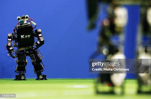 Humanoid robot of the children size league kicks the ball during the Robocup 2006 football world championships at the Congress Centre on June 14,...