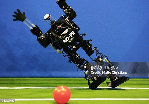 Humanoid robot of the children size league attempts a save during the Robocup 2006 football world championships at the Congress Centre on June 14,...