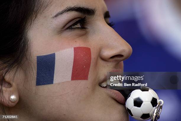 French fan blows her whistle during the FIFA World Cup Germany 2006 Group G match between France and Switzerland at the Gottlieb-Daimler Stadium on...