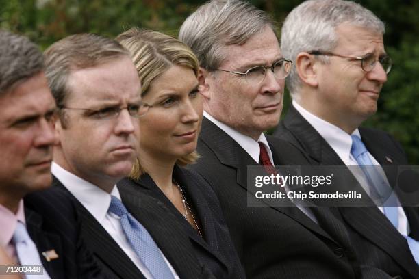 White House staff members Tony Snow, Dan Bartlett, Nicole Wallace, Stephen Hadley and Joshua Bolten listen to U.S. President George W. Bush as he...