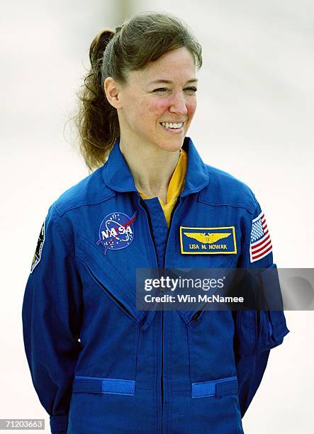 Mission specialist Lisa Nowak takes part in a launch pad press conference held by astronauts for NASA's next Space Shuttle mission, STS-121, June 14,...