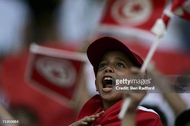 Young Tunisian fan cheers on his team during the FIFA World Cup Germany 2006 Group H match between Tunisia and Saudi Arabia at the Stadium Munich on...