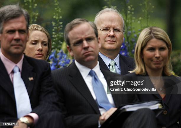 White House staff members Tony Snow, Dana Perino, Dan Bartlett, Karl Rove and Nicole Wallace listen to United States President George W. Bush as he...