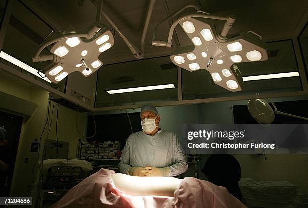 Consultant Surgeon Andrew Ready prepares to conduct a live donor kidney transplant at The Queen Elizabeth Hospital Birmingham on June 9 in...