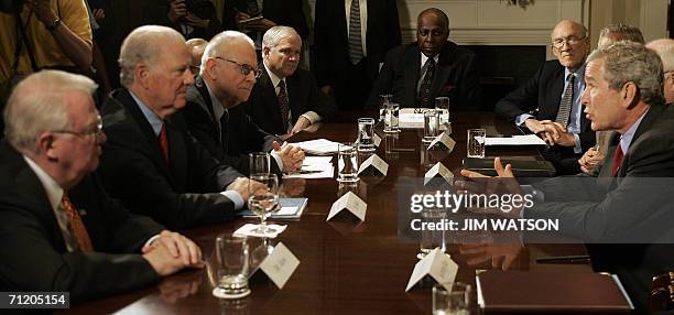 Washington, UNITED STATES: US President George W. Bush speaks with former US Attorney General Edwin Meese III , former Secretary of State James Baker...
