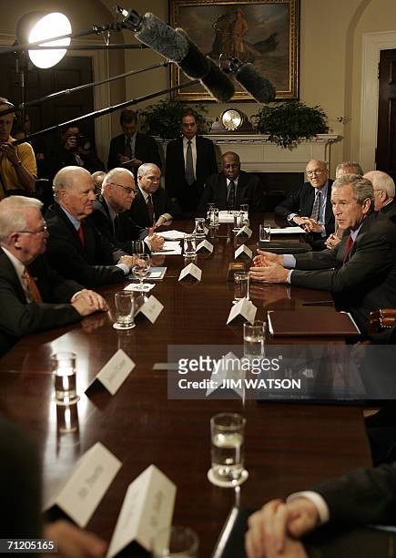 Washington, UNITED STATES: US President George W. Bush speaks with former US Attorney General Edwin Meese III , former Secretary of State James Baker...