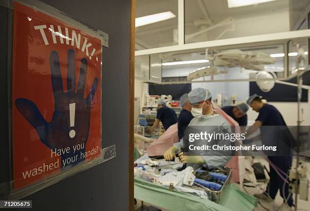 Surgeons at The Queen Elizabeth Hospital Birmingham conduct an operation on June 14, 2006 in Birmingham, England. Senior managers of the NHS have...