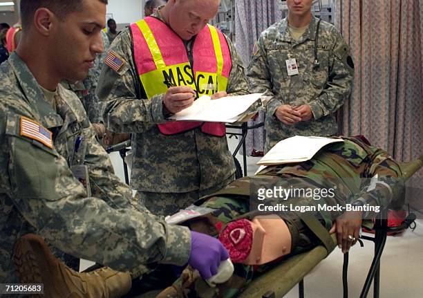 Person pretending to be injured is treated at Womack Army Hospital as part of Orbit Comet, an anti-terrorism and force protection training exercise...