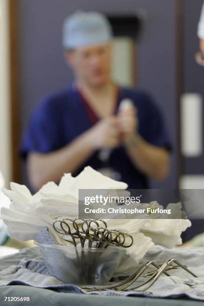 Surgeons at The Queen Elizabeth Hospital Birmingham conduct an operation on June 14, 2006 in Birmingham, England. Senior managers of the NHS have...