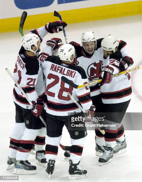 Defenseman Brian Rafalski of the New Jersey Devils celebrates with his teammates in game five of the Eastern Conference semifinals against the...