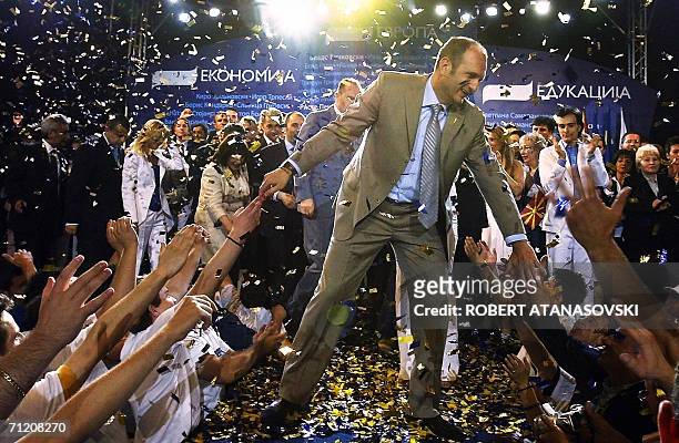 Macedonian Prime Minister and leader of Macedoni's ruling party, the Social-Democratic Union , Vlado Buckovski greets his supporters during a...