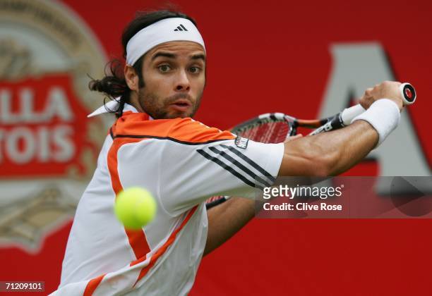 Fernando Gonzalez of Chile in action against Mark Philippoussis of Australia during Day 4 of the Stella Artois Championships at Queen's Club on June...