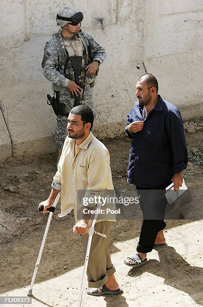 Iraqi prisoners leave the prison compound as another batch of 200 prisoners are freed from Abu Ghraib prison on June 15, 2006 in Baghdad, Iraq. Prime...