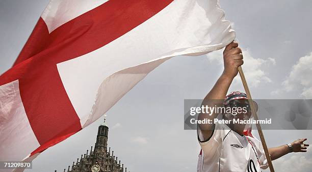 An England fan flies a St. George flag on June 15, 2006 in Nuremberg, Germany. England will face Trinidad and Tobago in their second group B match in...