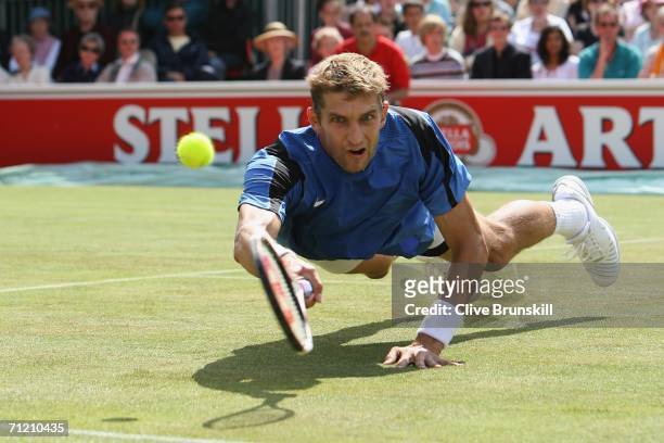 Max Mirnyi of Belarus in action against Lleyton Hewitt of Australia during Day 4 of the Stella Artois Championships at Queen's Club on June 15, 2006...