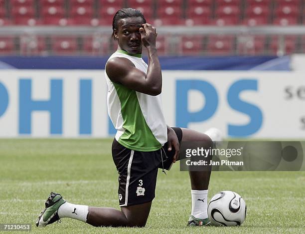 Arthur Boka of Ivory Coast stretches during a training session in the FIFA World Cup stadium on June 15, 2006 in Stuttgart, Germany. Ivory Coast...