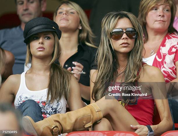 Singer Cheryl Tweedy the girlfriend of Ashley Cole and Victoria Beckham the wife of England Captain David Beckham, attend the FIFA World Cup Germany...