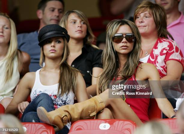 Singer Cheryl Tweedy the girlfriend of Ashley Cole and Victoria Beckham the wife of England Captain David Beckham, attend the FIFA World Cup Germany...