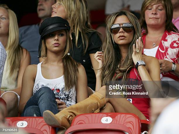 Singer Cheryl Tweedy the girlfriend of Ashley Cole and Victoria Beckham the wife of England Captain David Beckham, attend the FIFA World Cup Germany...