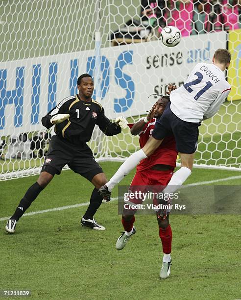 Peter Crouch of England rises above Brent Sancho , to score the opening goal past Shaka Hislop of Trinidad and Tobago during the FIFA World Cup...