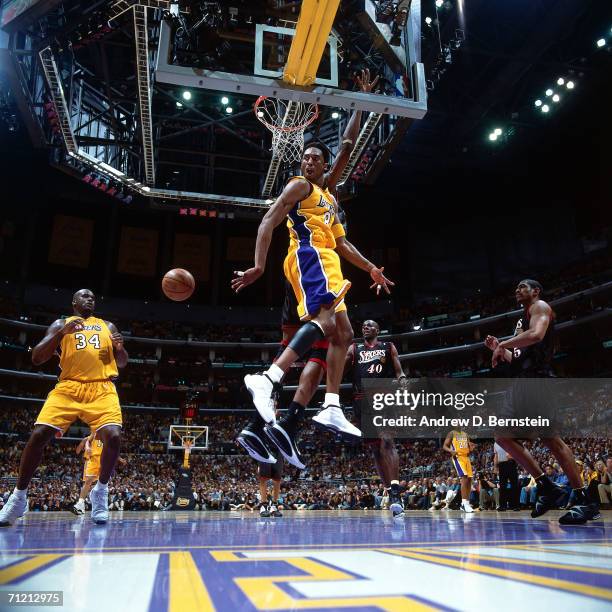 Kobe Bryant passes to teammate Shaquille O'Neal of the Los Angeles Lakers during Game one of the 2001 NBA Finals against the Philadelphia 76ers...