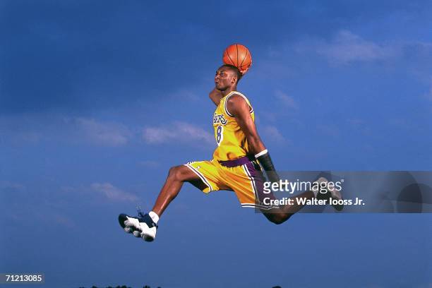 Kobe Bryant of the Los Angeles Lakers poses for an action portrait during a photo shoot session in 1997 in Los Angeles, Callifornia. NOTE TO USER:...