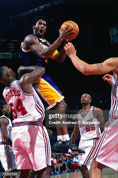 Kobe Bryant of the Los Angeles Lakers attempts a shot against Rodney Rogers of the Los Angeles Clippers in 1999 at the Los Angeles Memorial Sports...