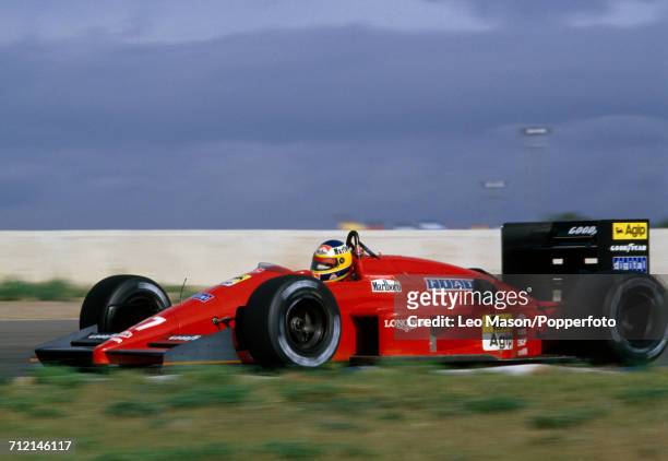 Michele Alboreto of Italy enroute to a fifteenth place finish, driving a Ferrari F1/87 with a Ferrari 033E 1.5 V6t engine for Scuderia Ferrari SpA...