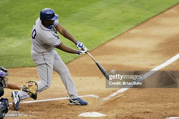 Joel Guzman of the Los Angeles Dodgers bats against the Colorado Rockies on June 10, 2006 at Coors Field in Denver, Colorado. The Rockies won 12-9.