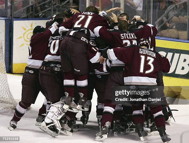 Members of the Hershey Bears celebrate winning the Calder Cup after defeating the Milwaukee Admirals 5-1 in game six of the AHL Calder Cup Finals on...