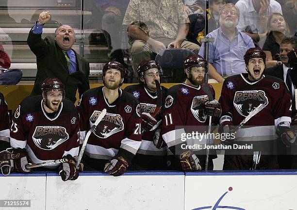 Head coach Bruce Boudreau , Kris Beech, Dave Steckel and Eric Fehr of the Hershey Bears celebrate winning the Calder Cup after defeating the...